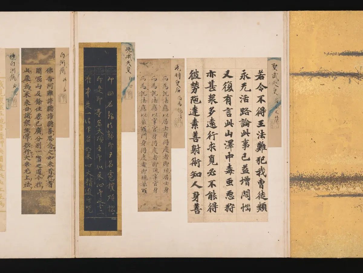 Open spread of a Japanese folding calligraphy album, A Mirror of Gathered Seaweed (Mokagami), displaying mounted poetry and calligraphy fragments by various hands
